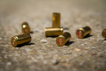 9 mm bullet shells. It's lying on the ground