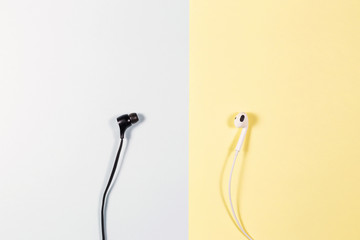 Black and white earphone on the paper soft tone color.