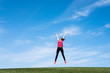 © Nickolay Khoroshkov - pretty young woman jumping on green grass