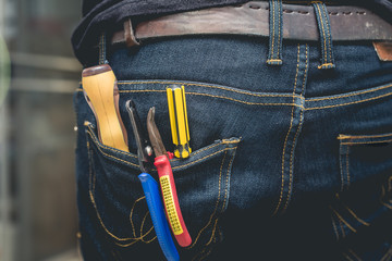 Wall Mural - tool kit in jean pocket