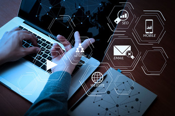 Poster - top view of Double exposure of businessman hand working with new modern computer and business strategy as concept