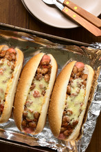Baked Chili Hot Dogs In Baking Pan, Photographed Overhead With Natural Light