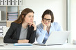 © Antonioguillem - Confused office workers consulting online information