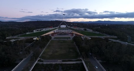 Wall Mural - Green park area surrounding capitol hill and new Australian parliament house in Canberra at sunset.
