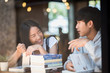 © Johnstocker - Group of happy friends student talking about knowledge in cafe