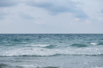  Wave on the beach, sea foam in the sea