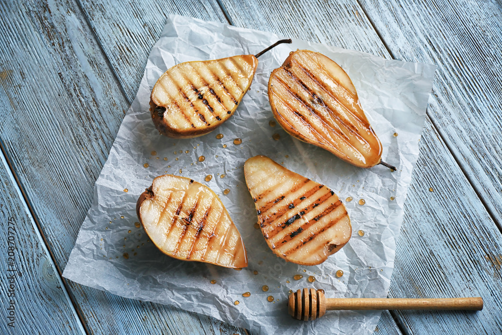 Tasty baked pears on table