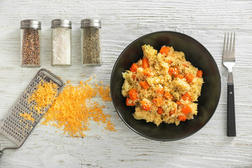 Canvas Print - Bowl with delicious pumpkin risotto on wooden table