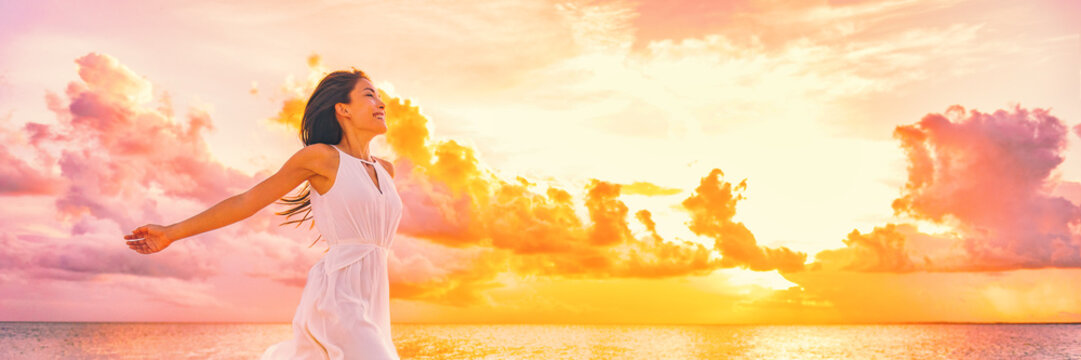 well being free woman with open arms in the air blissful happiness concept banner. happy woman again