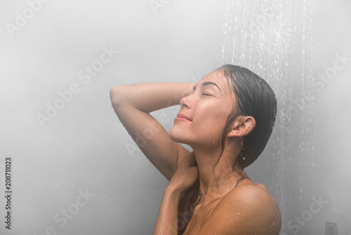Woman Taking A Shower Washing Hair At Home Under Warm Water Falling