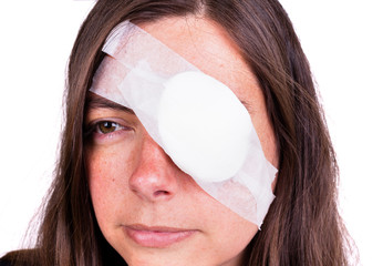 portrait of woman wearing eye patch as protection after injury