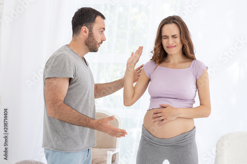 First Pregnancy Displeased Man And Pregnant Woman Talking And Arguing Stock Photo Adobe Stock