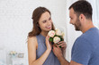 © Viacheslav Yakobchuk - Best wife. Adorable man presenting flowers to pregnant woman who smiling