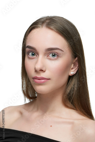 Sideview Of A Girl With Light Day Make Up Looking At Camera
