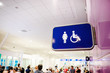© luengo_ua - Toilets icon. Public restroom signs with a disabled access symbol. Interior of airport terminal.