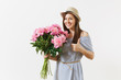 © ViDi Studio - Young tender woman in blue dress, hat holding bouquet of beautiful pink peonies flowers, showing thumbs up isolated on white background. St. Valentine's Day, International Women's Day holiday concept.