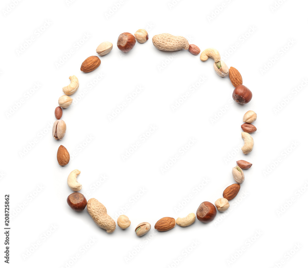 Frame made of different types of nuts on white background
