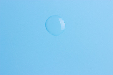 drop of water on a blue background