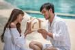 © May Chanikran - Happy smiling couple holding model house with dreaming together.