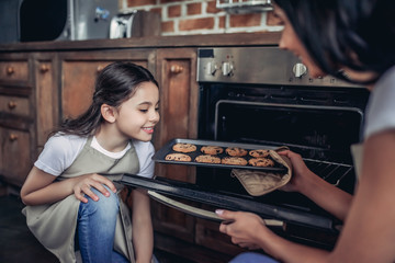 girl smelling fresh backed cookies