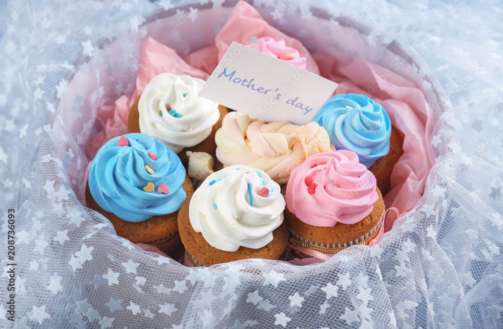 Tasty cupcakes in box, closeup. Mother's Day celebration