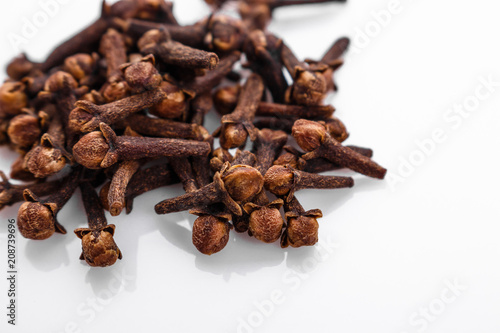 Fotografie, Obraz fragrant cloves on a white acrylic background