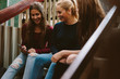 © Jacob Lund - High school girls sitting on the stairs