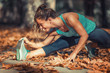 © Microgen - Woman Exercising Outdoors in The Fall