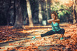 © Microgen - Woman Exercising Outdoors in The Fall