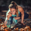 © Microgen - Woman Exercising Outdoors in The Fall
