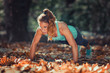 © Microgen - Woman doing push ups in the park