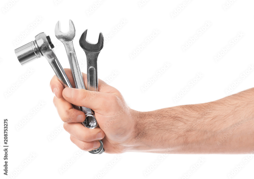 Hand of car mechanic holding tools on white background