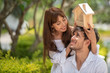 © May Chanikran - Happy smiling couple holding model house with dreaming together.
