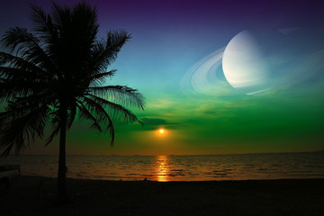 Wall Mural - Saturn near earth on night sky over the sea and sunset