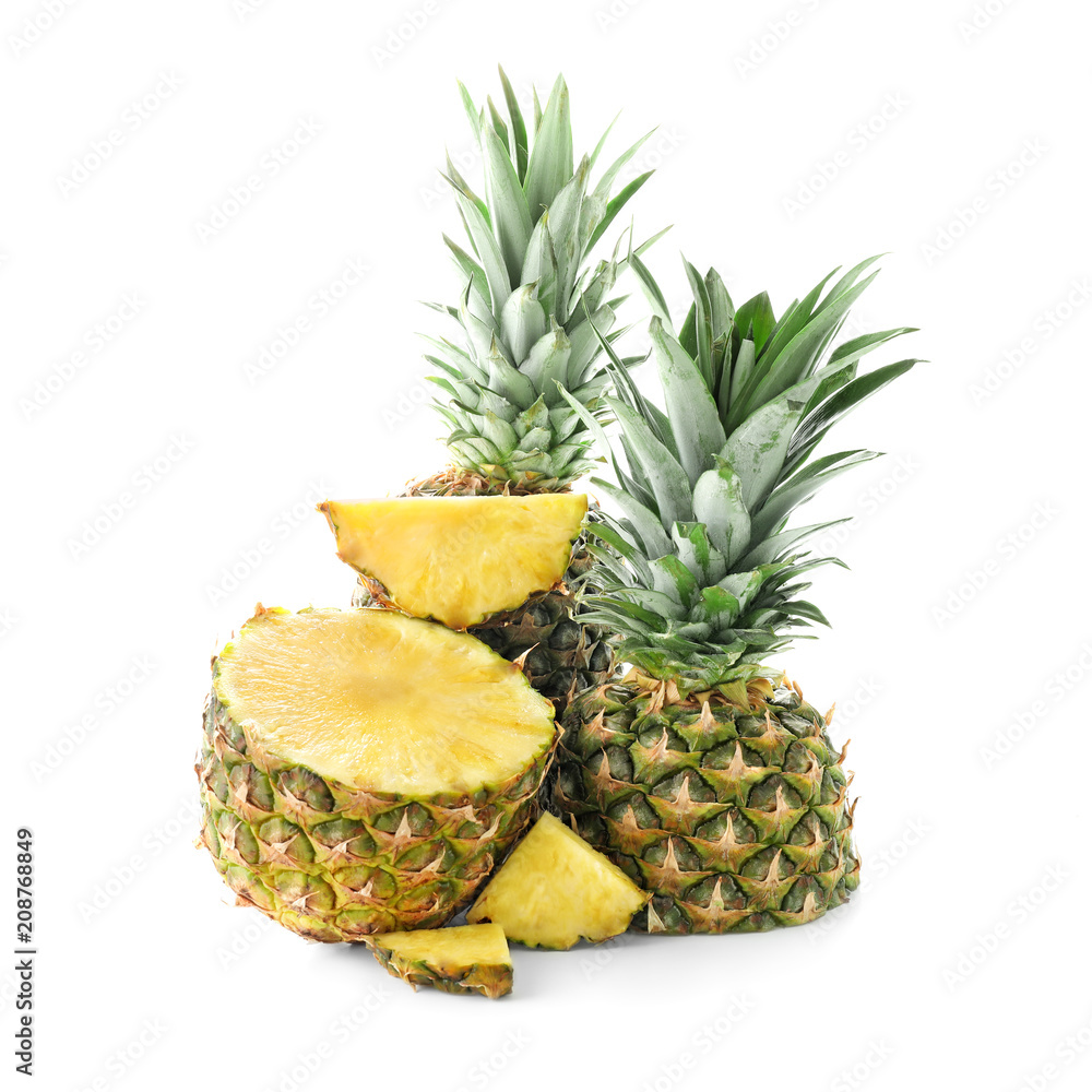 Delicious cut pineapples on white background