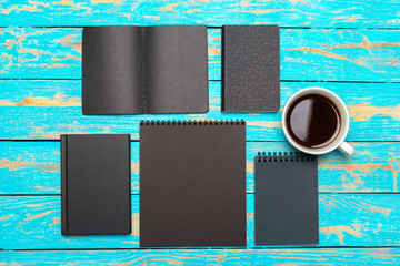 Sticker - Cup of coffee with notebook on wooden desk