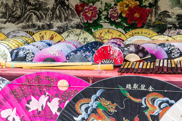 Traditional handicraft chinese fans at market in Yangshuo, China.