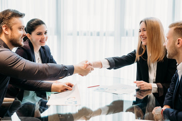 closing or sealing a deal. business partners shaking hands. cooperation partnership, trust joint venture concept