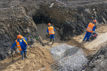 Wall Mural - the worker is building a trench