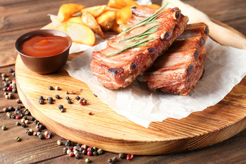 Sticker - Board with delicious grilled ribs on wooden table