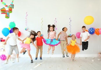 Cute little children at birthday party indoors