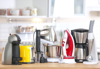 Canvas Print - Household and kitchen appliances on table indoors. Interior element