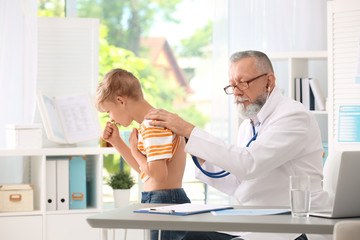 Poster - Doctor examining coughing little boy at clinic