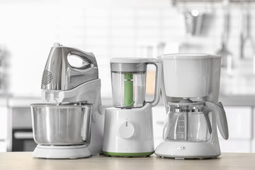 Poster - Kitchen appliances on table against blurred background