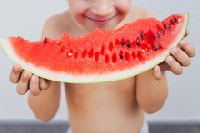 Happy Kid Holding A Watermelon