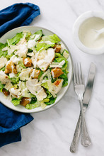 Classic Chicken Caesar Salad On Plate From Above