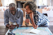 © trinettereed/Stocksy - Senior African American Couple planning a trip in retirement