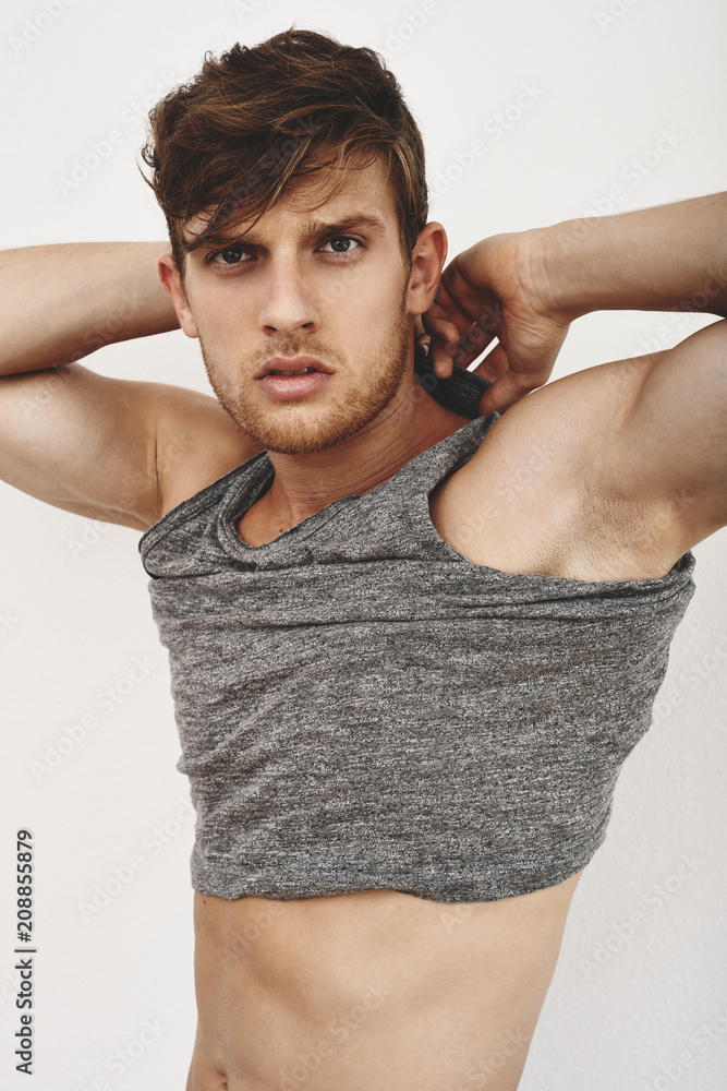 Top Strong Model Strong handsome model posing against white background Stock Photo ...