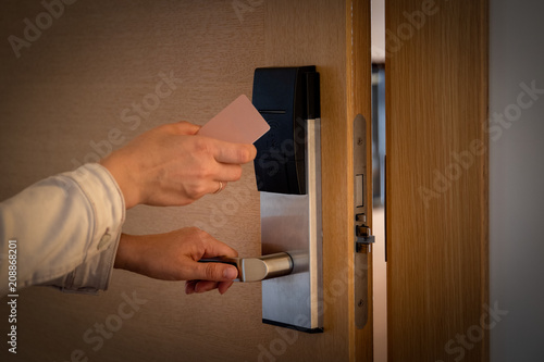 Fotografía Opening a hotel door with keyless entry card.