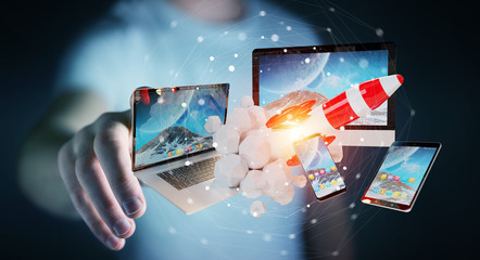 Businessman connecting tech devices and startup rocket 3D rendering